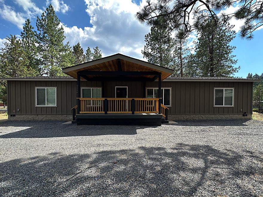 Better than new and loaded with upgrades, this 2023 home blends modern luxury with Bend's laid-back charm. Situated on a generous 0.39-acre lot in Romaine Village, it offers a detached garage, dual-entry driveway, and space for RVs or toys. Inside, enjoy high-end finishes like granite countertops, coffered ceilings, crown molding, luxury plank flooring, recessed lighting, and designer plumbing and lighting fixtures. The kitchen is an entertainer's dream with an oversized island, custom tile backsplash, touchless faucet, and built-in wine & beverage fridge. Both bathrooms feature dual sinks and upscale details. Smart home features include WiFi-enabled thermostat and smart lighting. HOA is just $22.50/month and includes indoor pool access, with optional Rec center privileges. Turnkey and ready for you to move in and start enjoying the lifestyle of Bend!