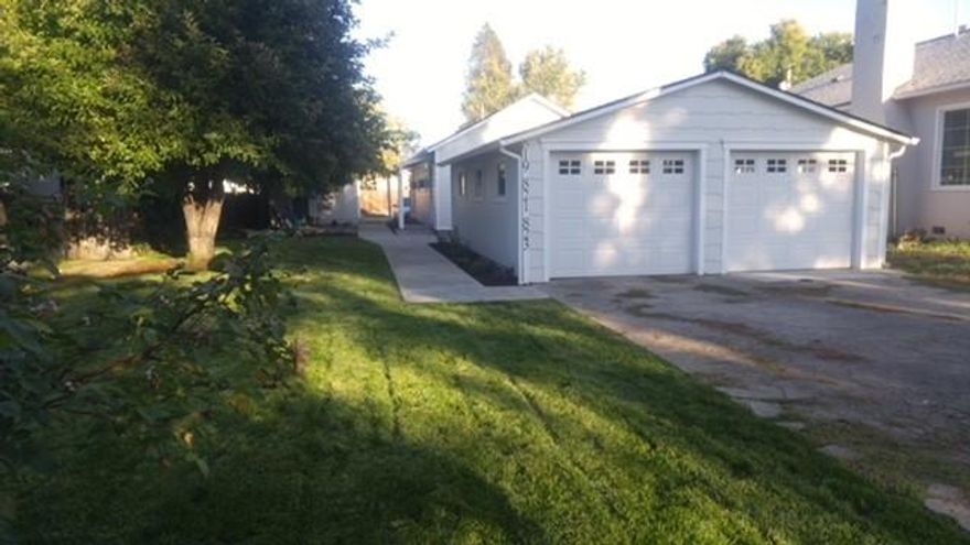 Great money maker! 3 units! A duplex with single car garages and a single home with off street parking and convenient alley access.  Easy access to shopping, schools, bus route and south interchange freeway access. Newer, cozy duplex units.  Updated and well maintained single home.  Nicely landscaped yard with sprinkler system.  Laundry facilities for all units in the garage.  2 car garage  with single spaces and garage door opener for each duplex tenant.  Great rents and all units are rented .