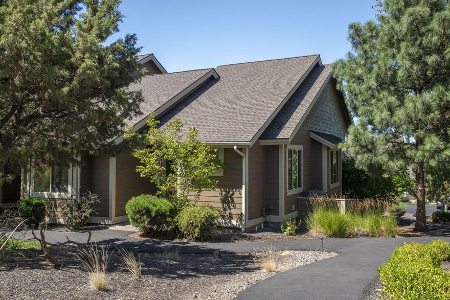 MOTIVATED SELLERS!  Take a look, make an offer! My clients are ready to go and so is this property.  Move-in ready with this effortless single-level townhome.  This 1,419 sq ft end-unit with 2 bedrooms and 2 bathrooms in Eagle Crest Resort boasts vaulted ceilings, luxury vinyl plank flooring, a cozy gas fireplace, and abundant natural light. It has a new water heater and HVAC system as well.  Thoughtful storage includes built-ins plus two exterior storage closets. Step outside to an elevated paver patio stubbed for gas grill, perfect for relaxing or entertaining. The townhome comes with 2 dedicated parking spots out front, and plenty of guest parking across the street, making it easy to entertain.  Enjoy resort-style amenities with miles of trails, pools, fitness centers, sport courts, restaurants, and three golf courses just moments away. Ideal as a primary residence, second home, or vacation rental.