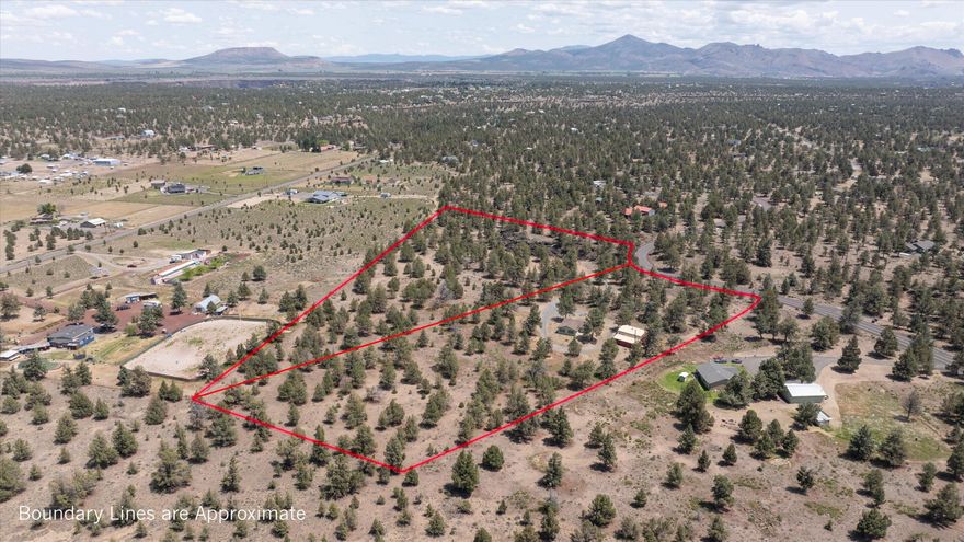 Here's a unique opportunity to purchase a home with two parcels in CRR. The main parcel (4.86 acres) has a recently renovated home (new interior and exterior paint) new carpet thru-out- with new range/oven and new dishwasher. Two full baths, Four bedrooms. Heat pump for comfort year round. New roof 2024. Deepened domestic well and new well pump May 2025. Two story shop /barn with horse stalls, water & power and additional finished bonus room/office upstairs. The second parcel is bareland (5.71 acres)  that is included in the sale. This parcel is a separate tax lot and has many possibilities or maintain them as one for a total of 10.57 acres. Nicely secluded with spectacular rock formations.