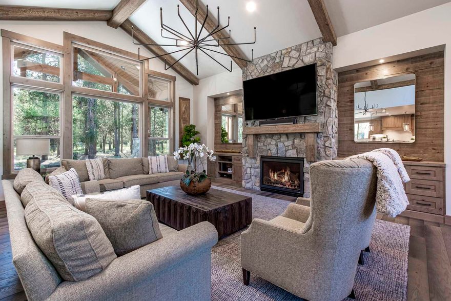 Spectacular eastern-facing home in Caldera Springs! Quality craftsmanship throughout and a fantastic floor plan provide everyone with the space they need. There are three on suites on main level along with great room, gourmet kitchen, laundry/mud room. Upstairs find three more suites, + bunk/bonus room. Expansive paver patio with hot tub for relaxing or entertaining. Enjoy the forested green belt off the back patio. Designed to bring family and friends together. Enjoy paddling and fishing the lakes, walking along the trails, or gathering around the fire pit to share stories and memories. Caldera Springs offers all the amenities for your family to relax, rejuvenate and reconnect. Sold Furnished. Contact your agent to preview today.