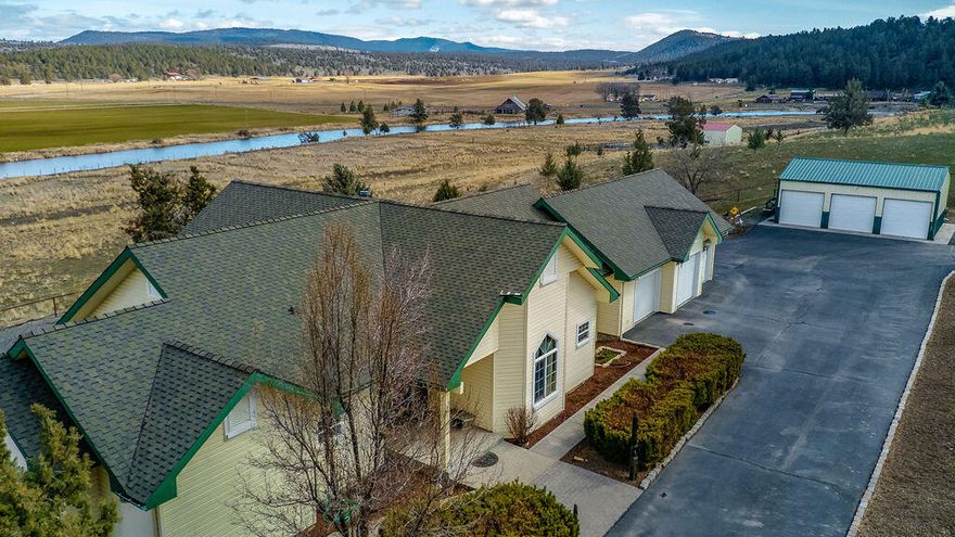 Don't wait to see this stunning custom home along the Lost River, located just 16 miles outside Klamath Falls. The property features 15 acres & a beautiful 3482 ft.² house with vaulted ceilings, hardwood floors, and gorgeous views throughout the main floor living space. The fully updated kitchen is equipped with high-end stainless steel appliances, custom Borror cabinets, and granite counters. From the attached deck, watch beavers, birds and other wildlife in the river. The primary bedroom has two walk-in closets and a large en-suite bathroom. The second bedroom also has it's own bathroom and spacious walk-in closet. Downstairs is a large bonus room, third bedroom, full bathroom and utility room. Great opportunity for separate living quarters or potential for an income producing unit. There's a three-car attached garage, PLUS a three-bay detached shop. The property is cross fenced, with pasture irrigated from Lost River and set up for cattle with a fantastic ''nose pump'' watering system