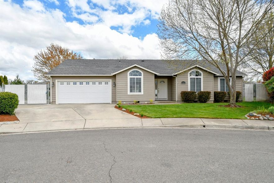 Central Point Home on large lot! Just updated! Sitting at the end of the cul-de-sac on .25 of an acre, this 1999 home features 4 Bedrooms, 2 Bathrooms, approx.. 1566 sqft., an open split floor plan, large kitchen with vaulted ceiling, dining room, large living room with vaulted ceiling. Recently updated with, new carpet & vinyl floors, new paint, new garage door, refinished kitchen cabinets, new sink & faucet, new gas water heater and more. Nice master with walk-in closet and double sinks in the master bathroom. Very nice setting in the back with a large concrete covered patio wired for hot tub and overlooks the beautiful big fenced backyard. RV parking behind fencing, storage/garden shed. Conveniently located near Schools, shopping & Central Point/Medford amenities.