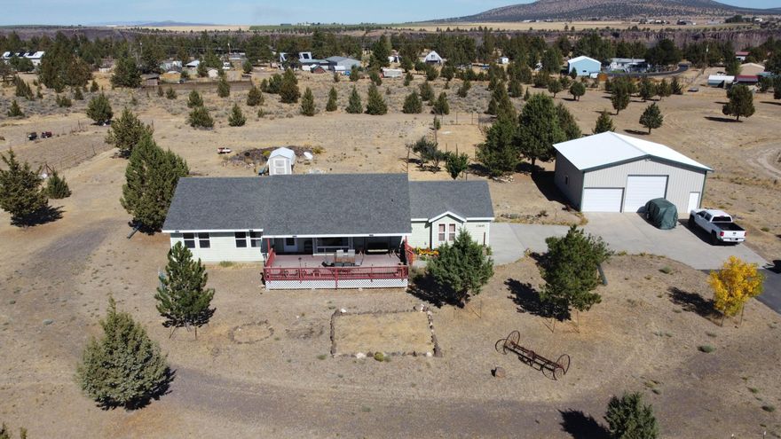 Ideal setting, conveniently located in Crooked River Ranch, with a custom single-story stickbuilt home that is a must-see! Residing on 2.79 acres with Cascade Mountain views, the home has an open floorplan with a spacious kitchen area that has ample cabinet space as well as large bedrooms. Recently added 36'x36' metal pole barn shop with access from tall RV doors as well as a second oversized double shop door. Shop already has storage shelves, power and lights. Property has low-maintenance landscaping as well as a huge concrete back patio space for entertaining and a paved driveway for ample parking. Enjoy all the Crooked River Ranch amenities plus be close to hiking trails, the Deschutes River, natural grasslands, BLM and much more!
