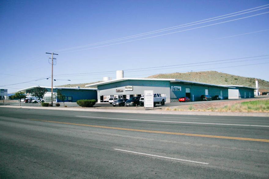 Industrial warehouse for lease. This listing is for the far right back warehouse which is 21,000 sq ft comprised of approx. 1000 sq. ft. office/reception area with single bathroom and 20,000 warehouse with fire sprinkler system. No heat in the warehouse.  Tall roll-up doors. NNN lease. Owner may consider dividing into 5000 sq. ft. spaces with acceptable long-term tenant.