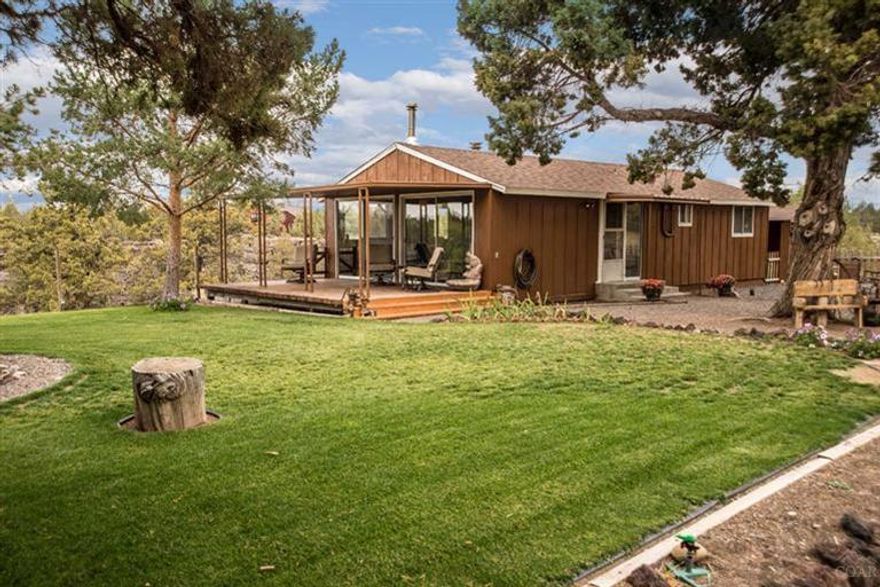 Play where you live....live where you play. That's the Central Oregon Way. Have it all. River And Mountain views. Fish, hike, bike or settle in for a stunning sunset from your rustic 2 bedroom, 1 bath cabin, double car garage w/plumbed studio room in between for hobbies, exercise or guests. Set on 3 acres w/end of the road privacy, yet 30 min or less to all your favorites, Bend, Sisters, Smith Rock, Redmond, Prineville, CRR.