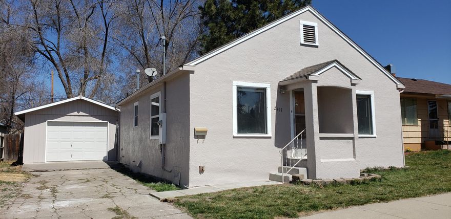 3 bedroom 2 full bath home in excellent condition. This home has almost all new interior and exterior paint. New laminate flooring.  Large master bedroom with garden bath. Spacious detached one car garage with concrete driveway. Alley access to back yard. Vinyl windows. Small corner of back lot has been partitioned off.  This is ready to move in.