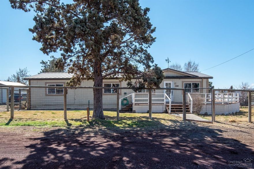 Looking for a shop and lots of parking Your search has just ended! 1,056 sq/ft/ shop with a 12ft tall door, 220 power. Upper loft for storage, 1/3 acre corner lot offers generous space to park all your vehicles or have a garden. One story comfortable home with Cascade Mt. views. New stainless steel appliances, pellet stove and large deck. Fenced yard with mature trees. Also a seperate hobby shop building. All in the heart of Terrebonne with the elementary school close by.