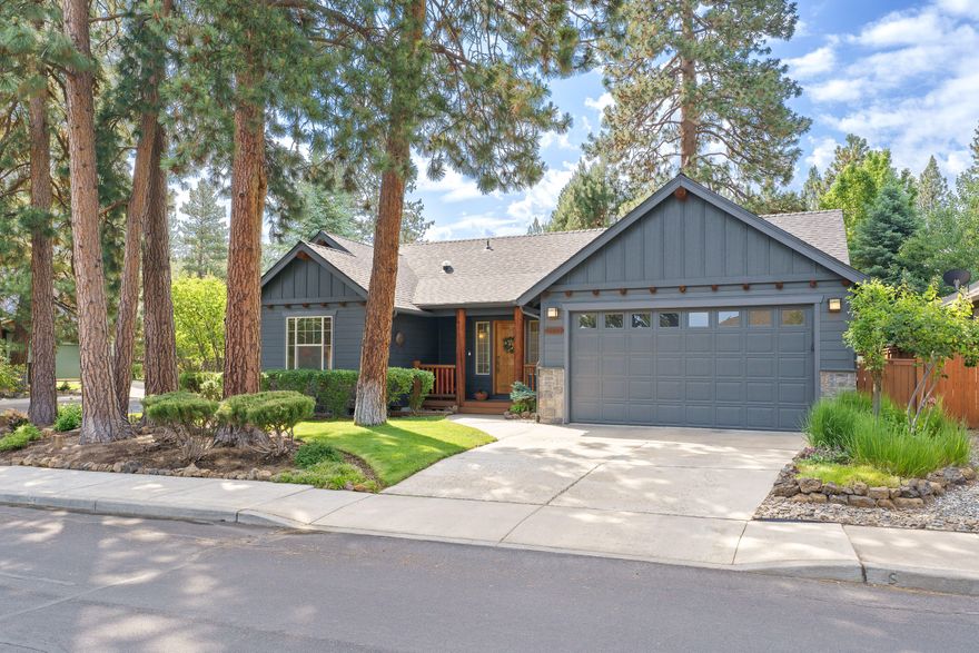 Beautiful SINGLE LEVEL home in the Mountain Pines neighborhood.  This large corner lot with stunning landscaping provides plenty of privacy.  Open floorplan with vaulted ceilings, wood wrapped windows, laminate wood floors throughout and NO CARPET.  Large great room with a gas fireplace and the kitchen has an island, slab granite counters, newer stainless-steel range, microwave/hood and dishwasher. Spacious primary suite has a sliding door to the backyard, ceiling fan, walk-in closet and bath with granite counters and double sinks. Two guest rooms, one with built-in bookshelves is perfect for an office.  Laundry room with sink and cabinets. AIR CONDITIONING!  Garage with built-ins. New roof and exterior/interior paint in 2024. Close to 3 golf courses, shopping and Little Fawn Park.