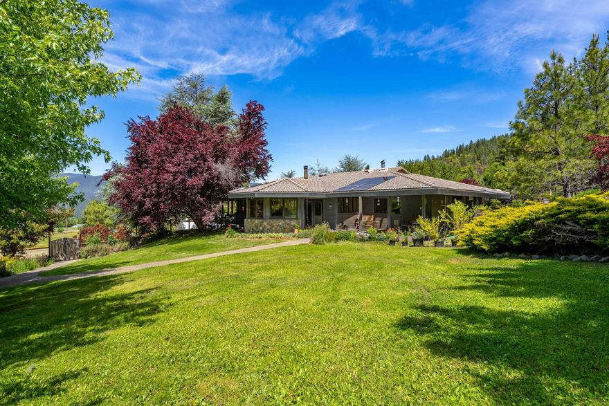 Incredible 50-acre property with panoramic views, ideal for livestock, horses, or homesteading. Features include a high-producing well, solar power, fenced garden, seasonal creek, three ponds, and wooded trails. There is a large pole barn, hay storage, corral, 2-stall horse barn with tack room, 8-stall equipment barn, mechanic's garage with a walk down mechanics pit, and garage/shop with loft and craft room. Land is currently being used for first cutting grass hay production and averages 8 tons a year. Though not certified organic, the land has been kept chemical free for the last 12 years. Frank Loyd Wright inspired 2,440 sq ft main home secluded in landscaped grounds featuring, fruit trees, berries, flowers and shrubs. Property also includes a 3BD/2BA manufactured home, that is currently rented and set well away from the main house for  privacy.