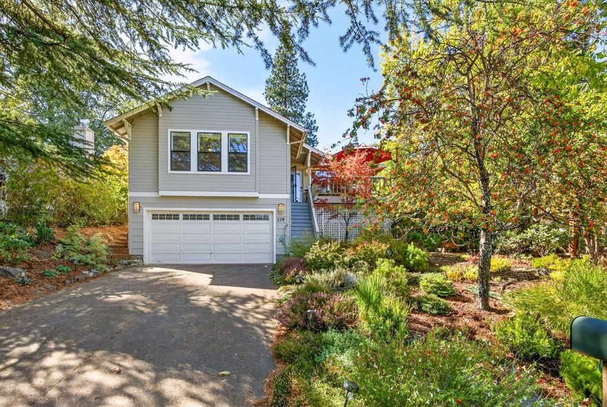 Nestled in a peaceful neighborhood just minutes from downtown Ashland, this 3-bed, 2-bath home radiates warmth & charm.  The living room flows to the dining area & office/sunroom, where natural light enhances the sense of space & creates a seamless connection to the vibrant backyard.  Delight in cozy moments by the fireplace, while the updated kitchen, featuring quartz countertops & stainless steel appliances, invites effortless entertaining.  The primary suite offers a mini-split for year-round comfort & a spa-like tiled bath with skylights, dual vanity & a step-in shower; the second bath also features a stylish step-in shower.  Recent upgrades include a 2024 HVAC system, fresh paint inside & out, engineered hardwood floors, new lighting & a 2017 roof.  Fabulous views for dining al fresco on the front deck or sip cocktails in the private, flower-filled backyard-uniting comfort, beauty & place.