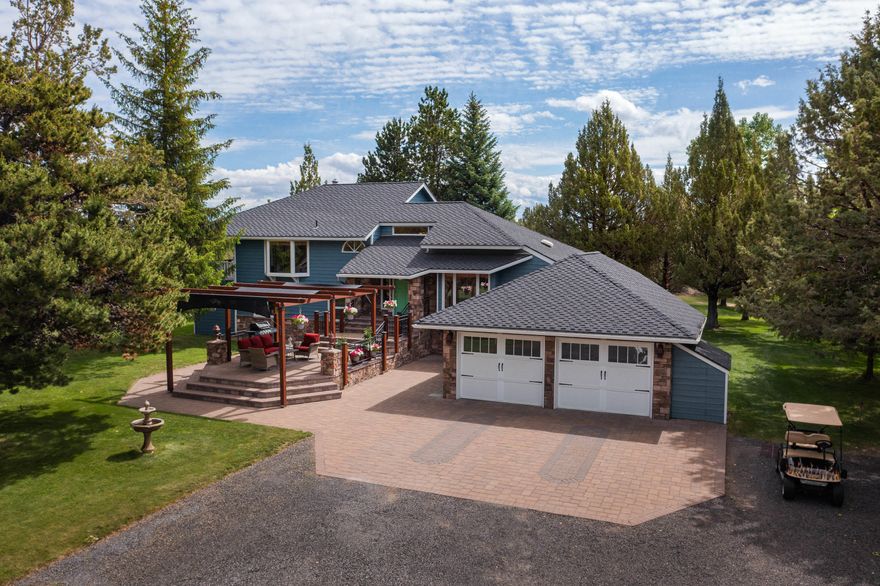 Perfectly situated w/easy access to the heart of Bend, Redmond & Sunriver!  A sense of peace & tranquility captured as you enjoy the ponds & seasonal canal along the West side with 2.5acres of irrigation. An expansive park like setting on 8.7acres w/2 entrances including an insulated 1756sq ft workshop. Plenty of space to build a barn for that self-sustaining farm. Secluded corner lot allows for privacy while being close to town. Relax on the front paver patio under the pergola providing just the right amount of shade. The back deck overlooks another pond w/water features creating the perfect setting for entertaining! New exterior paint & lifetime warranty roof. Just under 2,900sq ft w/4 bedrooms & unique touches including a game room, a sunroom, & a theatre room that makes this home one of a kind! The basement has plenty of room for storage or a wine cellar! Enjoy a quiet morning on the balcony located off of the master bedroom. Check out the Walk-through/Drone Video presentation!