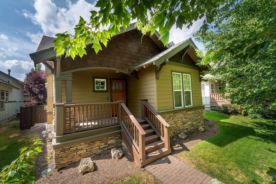 Welcome to this beautifully maintained Northwest Craftsman home located in the desirable Oakview neighborhood of Bend. Built in 2003, this single-level residence offers 3 bedrooms, 2.5 bathrooms, and 1,724 square feet of thoughtfully designed living space. The open-concept floor plan features vaulted ceilings, a spacious great room with a cozy gas fireplace, and gorgeous birch hardwood floors throughout. The kitchen connects seamlessly to the living and dining areas, making it perfect for entertaining. The primary suite includes a walk-in closet and en suite bathroom, while the upstairs bonus area provides added flexibility for a home office or guest space. Step outside to enjoy a custom paver patio, and a charming covered front porch. Conveniently located near schools, parks, and shopping, this home offers both comfort and convenience.