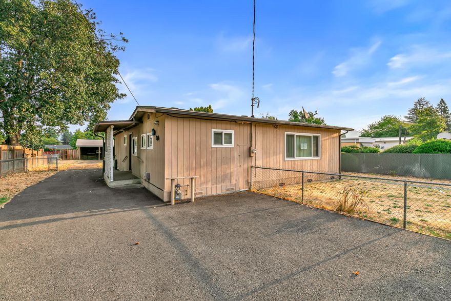 PRICE IMPROVEMENT of almost $30,000!!!  This charming 3 bedroom, 1 bath home sits on a big lot with tons of space for parking, growing, or expanding—lots of possibilities here! Whether you decide to keep the original character or update it, this home has room to make it your own.

As you walk in, you'll find a cozy dining area that leads right into the kitchen, which opens up to an enclosed porch. The living room is just off the kitchen, and the first bedroom is tucked nearby. On the other side of the house, there's a second bedroom with a bonus flex space—perfect for an office, extra closet, or whatever fits your needs!  The third bedroom would also make a great home office.

 Outside, you've got a big backyard, plus a detached carport with storage and workshop area .

At just $259,200, this one's a great find. Come check it out before it's gone!