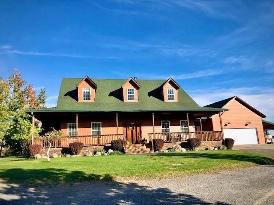 Beautiful 2252sf 3 bed 2.5 bath home with wrap around porch, oversized 30x24 garage, cold cellar & amazing mountain or city views from every window & every corner of this 20 acre property. Just minutes from downtown this home features 9 ft ceilings & 1st floor master suite with walk in closet, lrg bath with clawfoot tub to enjoy the amazing sunsets & french doors to back deck. Property features a variety of terrains & foliage including native bunch grasses, wild flowers, juniper, aspens, choke cherries +fenced orchard /garden with a dozen fruit trees, raised garden beds & chicken coop/shed with loft. Approx 4+ acres, newly fenced with 6 strand smooth wire New Zealand style fence,1800sf shop/barn &18x60 covered spaces on either side.  Great bonuses include patio spaces, inground sprinkler system, wood stove, electric furnace, central air conditioning, hardwood floors & easy access to the Moore Park trail system.