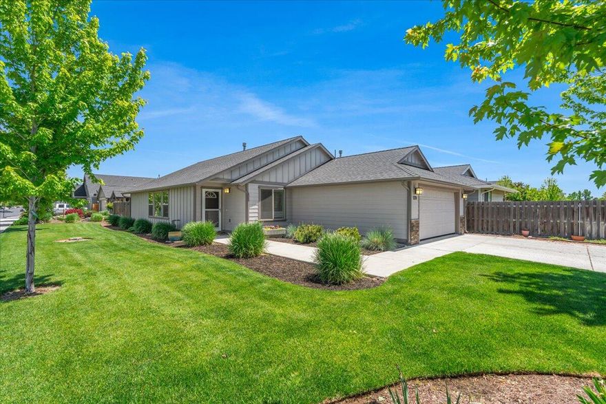 Located in a great neighborhood, this bright, immaculately maintained, single-level home on large corner lot is the perfect place to call home. Open floor plan features vaulted ceilings, gas fireplace, LVP flooring and multiple large windows that flood the space with natural light. Generous primary bedroom and bathroom includes large walk-in closet and has nice separation from additional two bedrooms. Recently updated kitchen with solid counters and full tile backsplash is both beautiful and efficient. Large, beautifully landscaped, fully fenced backyard with covered pergola is both private and tranquil, perfect for pets or entertaining in all seasons. Move-in ready, this home provides comfortable living in a great location in Redmond with easy access to outdoor recreation and city amenities. Pride of ownership is evident throughout the property. Don't miss this opportunity to enjoy a single-level, well-designed home in a prime Central Oregon location.