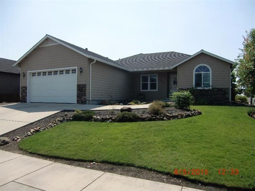 Beautiful 2007 built custom home is loaded with features and upgrades and includes full length RV parking! Wonderful 3 bed, 2 bath split floor plan has upgraded trim package and custom cabinetry plus a stainless appliances package. The master suite features a large master bath with his and hers walk in closets. Other features include tile flooring, gas fireplace and more! Nice sized covered patio includes gas outlet for BBQ and hot tub wiring. The garage is over sized and includes and enclosed additional storage area and built in cabinets. RV parking area is concrete paved and approximately 60' long.