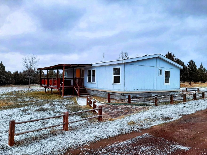 Tenants have moved out! The home has been all cleaned up and is ready to go! 2bd, 2ba 1080 sqft manufactured home on 1.83 acres is ready for you to buy now! Situated on a spacious flat lot with a good mix of cleared out space and treed areas. Possibility to add a shop, a barn, a chicken coop, a greenhouse - all sorts of things to keep plants/critters/toys. Country living but not too far out. Mostly paved roads to your new home - about 600' from Umatilla to your driveway. It has a nice covered deck out front to hang out on if being outside is your thing. Give your favorite agent a call and come and get it!