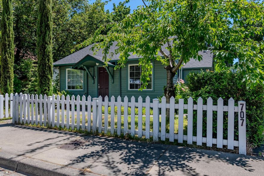 This charming 2-bedroom, 1-bath cottage in Grants Pass is full of character and curb appeal, with a classic white picket fence that adds to its welcoming feel. The light and bright home is well maintained and offers a cozy 744 square feet of living space. A detached garage with a bonus room adds flexibility for storage, hobbies, or a home office. The large backyard provides plenty of room to relax or garden, and the convenient location puts shopping and amenities just minutes away.