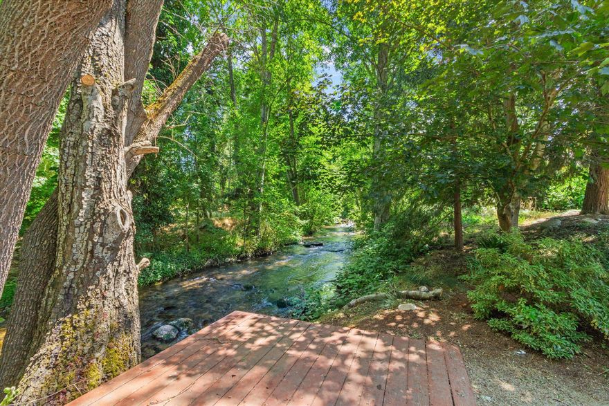 Looking for Creek Access, Welcome to 520 Helman Street—an energy-efficient creek side retreat in one of Ashland's most desirable neighborhoods. Enjoy direct access to a peaceful creek in a park-like setting with mature trees, a private putting green, and expansive outdoor living areas ideal for entertaining or relaxing. The well-maintained home features light-filled interiors, an updated kitchen, quality finishes, and a warm, inviting atmosphere. A versatile upstairs bonus room provides flexible space for a home office, guest suite, or studio. Unwind on the deck with the soothing sound of the creek just steps away. Ideally located just minutes from downtown Ashland, this unique property offers the perfect blend of privacy, charm, and convenience! Schedule your private showing today! Sellers Motivated!