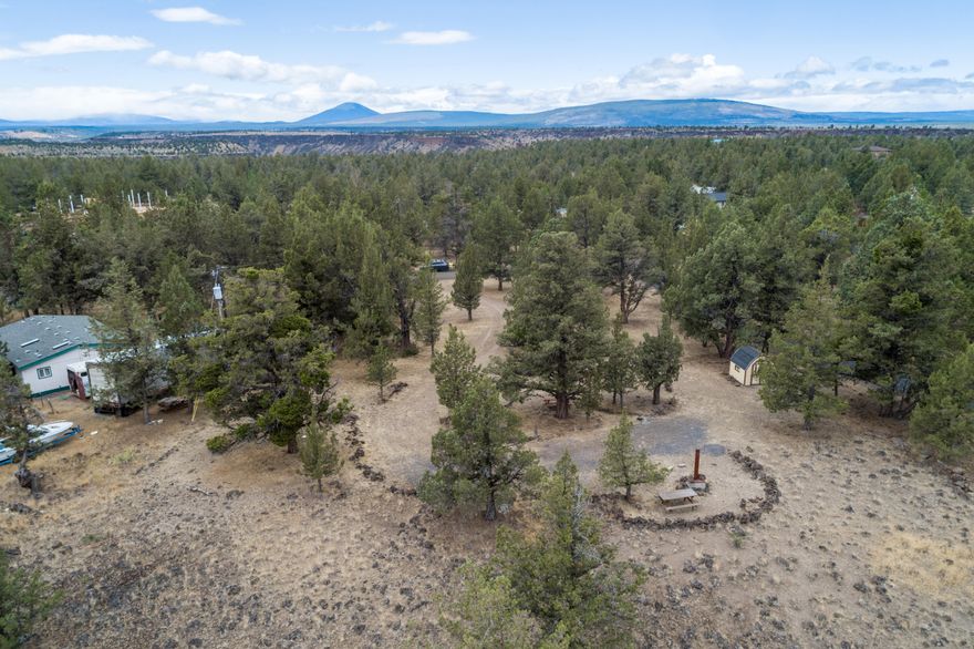 Hard to find!  1.3 acre lot on Crooked River Ranch with community water available to connect.  Power available at lot line.  Requires new septic approval.  Lot is on a cul-de-sac and a moment away from Scout Camp Trail Head where you will enjoy a 2.3 mile loop trail.  Property has a U-shaped driveway and is flat with a slight rise.  It is a blank canvas, just waiting for you to customize-to-suit!  Enjoy all the amenities Crooked River Ranch has to offer such as golf, swimming, tennis, pickle ball, soft ball, disk golf, walking trail, hiking, public land and the best fishing this side of the Rockies!  We are just 20 minutes from lake sports and fishing in the summer and a half hour from snow skiing and snow sports in the winter.  At Smith Rock, towers of volcanic ash ride like spires out of the high desert!  This is the birthplace of American sport climbing and a fabulous place to hike, right in your backyard! Overnight accommodations, grocery store, restaurants and bar on site.