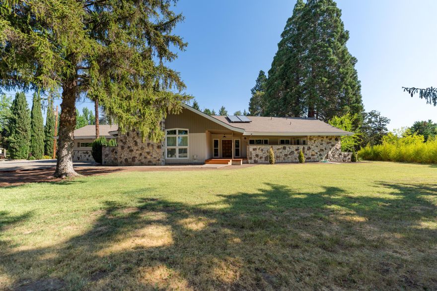 Ideal location! This .83 acre lot could be perfect for a large garden or a swimming pool addition, right in the heart of Central Point. High producing well and potential to tie into city water if preferred. 2119 s/f home featuring tons of character, exposed beams, 3 large bedrooms and 2.5 bathrooms. Recent renovations include kitchen remodel, bathroom updates, flooring, natural gas line ran, tankless water heater, tons of clean up and more. Mature landscaping and old growth trees provide shade and an established feeling in this huge back yard, running along Griffin Creek. Have toys or looking for ADU potential? Don't miss the oversized two car detached garage and an additional 2 car garage/shop combo out back. Plenty of room for an RV with electrical hookups already in place. Country living feel, yet still close to schools/town!