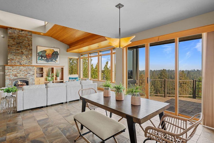 It's all about the location!! This 3,020 square foot home is situated in the center of almost 2
very private acres on Awbrey Butte, perched on the rimrock overlooking the Deschutes
River Canyon. With views of the river, Smith Rocks, Mount Hood, and city lights, this home is perfect for those looking for views and privacy. The primary suite, great room, office, two half baths, laundry, and 3 car garage are all located on the main level, which opens onto a paver deck overlooking the river canyon. There are two bedrooms downstairs, separated by a family room and bathroom, all with heated and stained concrete floors. The home is surrounded by mature landscaping, Ponderosa pines, aspen trees, and lava outcroppings. A short walk down into the canyon brings you to the Deschutes River Trail which follows the
river 2 miles in each direction - perfect for walkers, runners, bikers, and dog-owners. This property is a rare find - amazing privacy yet close to all that is Bend.