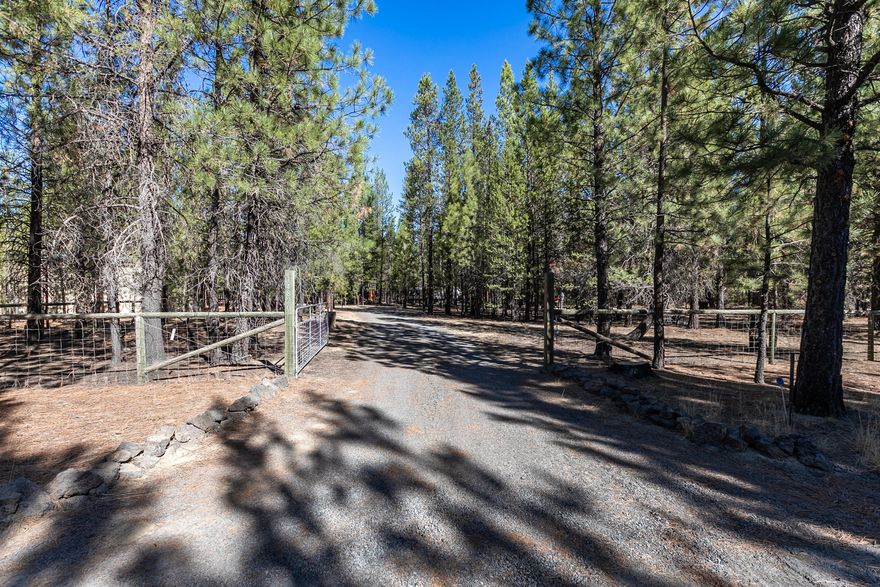 Beautiful flat, wooded building lot, with installed standard septic system, installed in 1999 by permit and suitable for a 3 bdrm/2 bath home. Water is provided through a community water association and 2 frost free bibs are installed and usable. Lot is located about 1/8 mile off paved area of Ponderosa Way. This firewise 2 acre lot has a graveled circular driveway and is fully fenced and gated. Two buildings are included, a 10x12 shed with storage and electricity, the other a 12x17 partially finished cabin, which has been used as a sleeping room. Two full RV hook-ups with water, power, and 2 dump stations. Currently used as a recreational site, it has a 2019 Forest River Vibe 36 ft trailer onsite and may be purchased outside escrow at an additional cost. Bring the family for vacation, hunting, or for your future building site with a place to live while the home is being built! HOA protected community with common areas that lead to forestland.