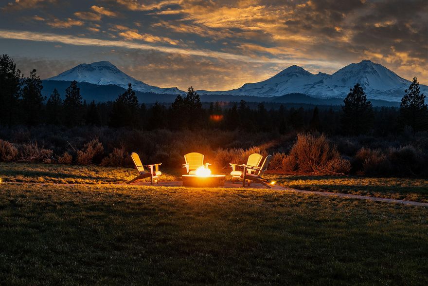 Rare meticulously managed 121.7 acres of sandy loam soil & old growth pine bordered by the Nat'l Forest w/ up close full views of the Cascades. 13 min. to Sisters, 28 min. to downtown Bend, serviced by the Redmond Airport hosting major airlines. Custom designed home by Steve Martin Construction, one level 1744 sq ft. 3-bed, 2-bath. Open concept living, knotty pine throughout. Propane stove, granite counters, slate flooring, pantry, floor to ceiling slate propane fireplace. Lg primary suite w/walk in closet, soaking tub/shower w/slate & granite counters, 2 adl bedrooms & full bath. Expansive green space w/ Nathan Good Architects designed timber Pergola w/ rare Idaho Glacial Stone, copper sink, custom cement counters, propane FP, BBQ & large fire pit, Jamestown paver paths. Pond, small pebble beach, lit waterfall, stargazing patio. Corral, fenced pasture, well designed hay & tack storage, 100s of miles of adj riding, hiking & mountain biking. Once in a lifetime privacy, peace & beauty.