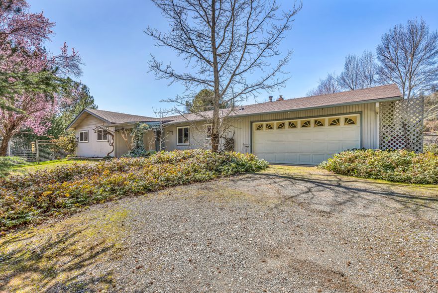 Looking for a quiet, serene place with beautiful views?  Love to play outdoors? Well, here it is the home for you! Situated on a little over 2 acres, close to BLM, hiking trails, parks and fishing and boating on the Applegate river, this 1644 sq. ft., 3 bed, 2 bath home is perfect for new owners wanting to make it their own! Kitchen has granite countertops with a breakfast bar and lots of storage. Large family & living rooms plus dining/ eating area. Master bedroom has a walk-in closet and attached full bath. Fenced garden to grow your own veggies, potential pasture space and an enclosed covered back deck with room for a hot tub.  Roof is approximately 5 yrs. old, and a brand-new oil furnace was installed 2021.