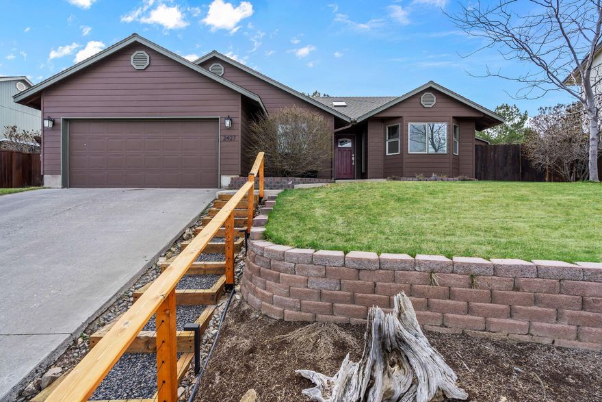 Nestled in the sought-after SW Redmond area, this home features quality craftsmanship! Immerse yourself in the warmth of hardwood floors that seamlessly flow through the main living spaces. City lights and views of Smith Rock grace your surroundings. Step through a tiled entry into a spacious living area with a Great Room layout. The kitchen is features a breakfast bar, ample prep space, and storage galore. Stainless steel farm sink, gas range, and dishwasher accentuate the kitchen's modern amenities. A pair of double doors off the kitchen lead to the back patio, a haven of comfort and relaxation. The covered patio invites you to unwind in style, creating an ideal space for entertaining.The primary bedroom is a retreat of its own, featuring a walk-in closet and a full bath with dual vanities. Practical features abound, including gas forced air for efficient heating. Beyond the home, revel in the fully fenced and landscaped surroundings, complete with a storage shed for added storage.