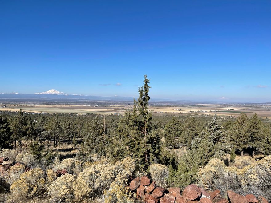 5.3 Acres with amazing MOUNTAIN VIEWS. A 38X48 insulated shop with concrete floor with plumbing for bathroom. All the hard work has been done, Complete Septic system installed, All utilities and water to build site, Driveway and gate and parking area all installed. All you need to do is build your custom home and enjoy the beautiful and extraordinary Cascade mountain views.