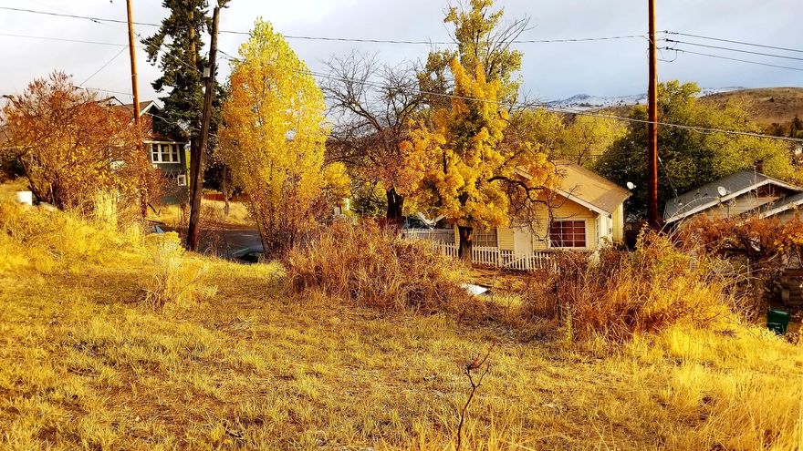 Incredible views from this buildable parcel on a small hill. Water, sewer, power all available at street. Owner will carry.