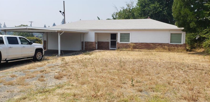 Commercial property in High visibility location on busy NE 7th Street in Grants Pass. It is a 2 bedroom 1 bath home with an oversize 2 car garage and carport. Would make a great location for office, retail, medical etc. Very little commercial property available in this price range.