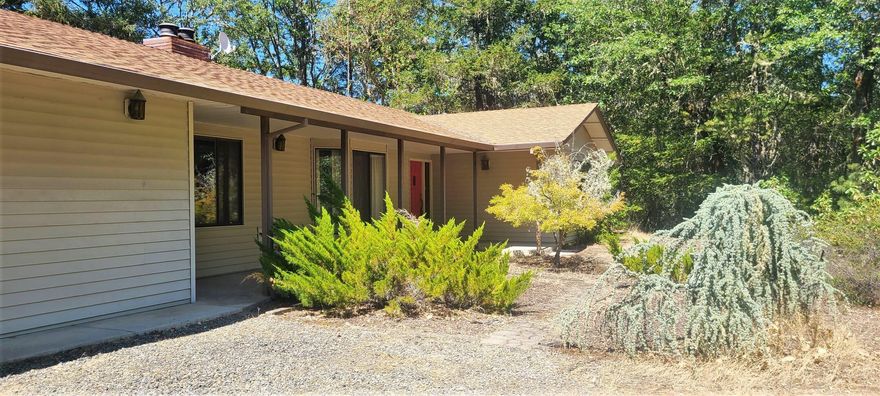 Private and quiet. Enjoy every sunrise from the front patio and every sunset from the back deck. Fantastic property at the end of a shared driveway, backed by BLM. This 3 bedroom 2 ½ bath house plus office and basement has so much to offer. Over 12 acres of rolling forested terrain, complete with seasonal pond that usually has water until late July. There's an attached oversized 2 car garage as well as a second unfinished 1 car garage with lots of storage. RV parking with power and septic hookups. Two garden areas as well as a small dog yard. So much potential with just a little TLC. Sold-as-is.