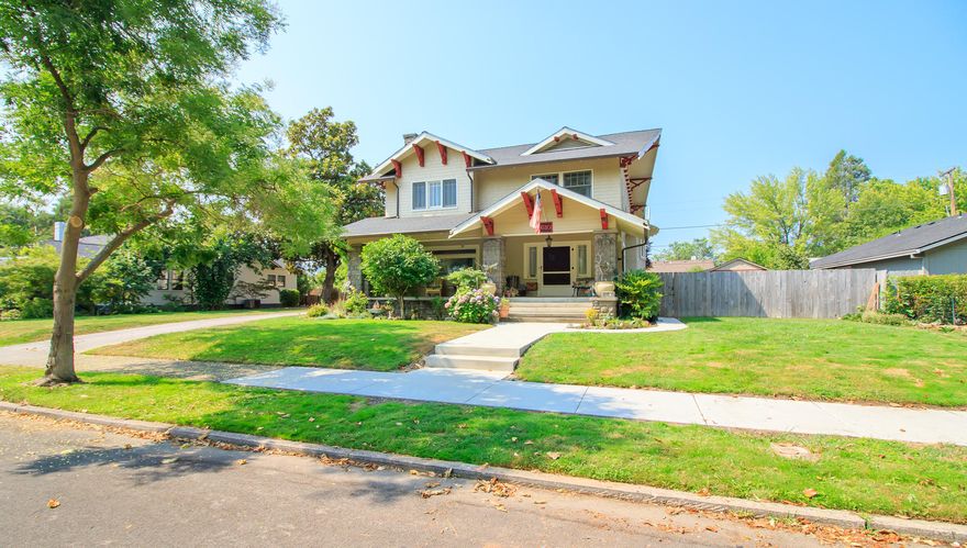 Wonderful craftsman with all the charm of a vintage home beginning with the inviting front porch complete with swing. You will be impressed with the classic original woodwork throughout the home - floors, wainscoting, crown moldings, staircases, beamed ceilings, pocket doors. The living room has a wood fireplace and is open to the large dining room w/ built-in hutch. Kitchen w/ newer stainless appliances and portable island. Nook w/ french doors. Cozy sun room, office/den, TV room and powder room complete the main floor. Upstairs are 4 bedrooms, 2 w/ sitting rooms and private baths. Updated Hall Bath has claw foot tub, tile floors.  Lots of storage with window seats, linen cabinets, walk-in pantry. Great private backyard w/ huge deck & hot tub, wooden shed, fenced area for pets or play yard. Det. garage/shop w/ 1-car garage door and shop or hobby area.