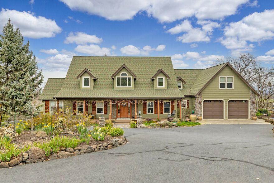 Beautiful 3br, 4ba Craftsman home w/sweeping views on 2.53 acres, minutes from Historic Jacksonville. First floor has wide plank hickory flooring, stone wood burning FP in living room w/expansive ceiling & exposed beams. Additional formal dining area or media room off entry. Kitchen has tile counters & floors, pull out drawers in cabinets, two separate pantries, Amana fridge & Electrolux gas stove top & electric oven w/ warming tray. Bay window gives beautiful panoramic view. Primary bedroom on first floor & features slider to back deck, walk-in closet, jetted tub, dual sink vanity & separate office w/window seating. Two separate stairways lead upstairs w/two large bedrooms & full bathrooms, skylights & media/craft room. Tons of storage thru-out. Outside w/RV parking, fenced field, dog run, raised garden beds, landscaping on drip system, new Trex deck & porch and well pump. Large 2 car garage w/workshop. Medford School Dist. & Jville Elementary. TV in upstairs media room stays.