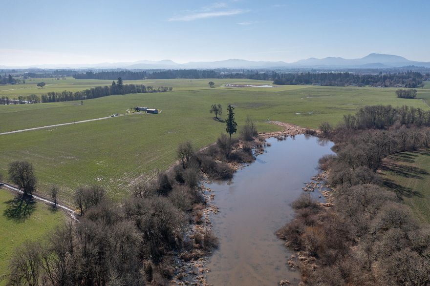 Spectacular 80-acre estate just minutes from OSU and Corvallis. At the end of a private half-mile drive, a well-maintained 2093 sqft manufactured home offers stunning views of the Coast Range and Cascades. Predominantly Class I and II soils with 6 acres of water rights provide excellent agricultural potential. A rare ancient lake on the property holds evidence of early human activity in North America. A unique blend of history, productivity, and breathtaking scenery—an opportunity not to be missed!