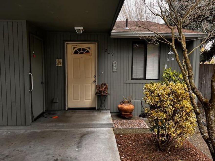 Nice one story condo in need of some repair and updating.  End unit with access to the pretty good sized back yard.  Double carport.