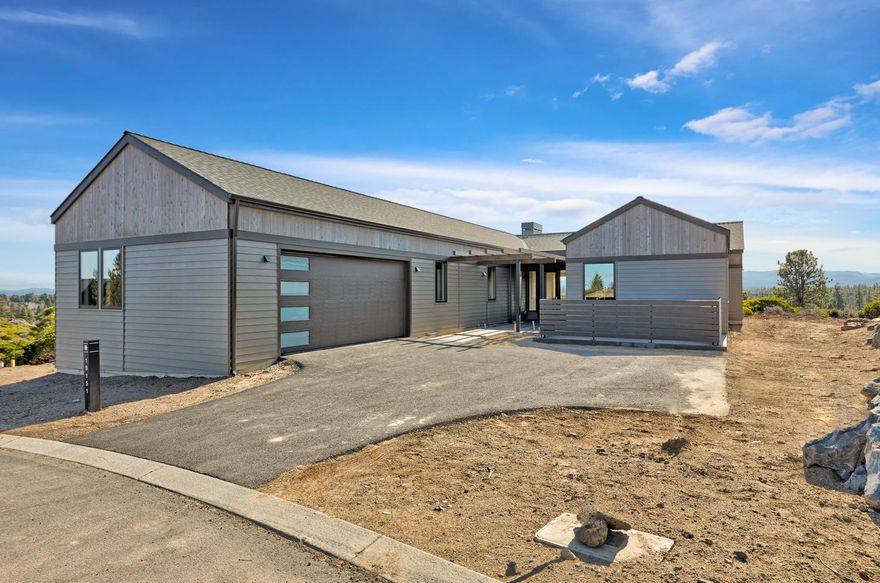 This enclave of homes built by BendTrend is quickly taking shape and is poised to be a premier neighborhood within the Tetherow community.  This homesite features a spacious single-level floor plan with 3 bedrooms, a flexible family room with attached bath, and an oversized 2-car garage.  Luxury finishes and craftsmanship throughout include hardwood floors in the main living areas, quartz countertops in the kitchen and bathrooms, and tiled showers and floors in the bathrooms.  The walkout deck off the back of the home overlooks the Deschutes National Forest with Cascade Mtn view and features both covered and sunny outdoor entertaining spaces.  Direct access to Phil's Trail system for mountain biking and hiking is just out your back door and the community is across from the Tetherow pool,  fitness center, dining, and golf course.  Social membership initiation fee in included.  These private residences may not be used as vacation rentals.  Interior photos are of other completed homes.