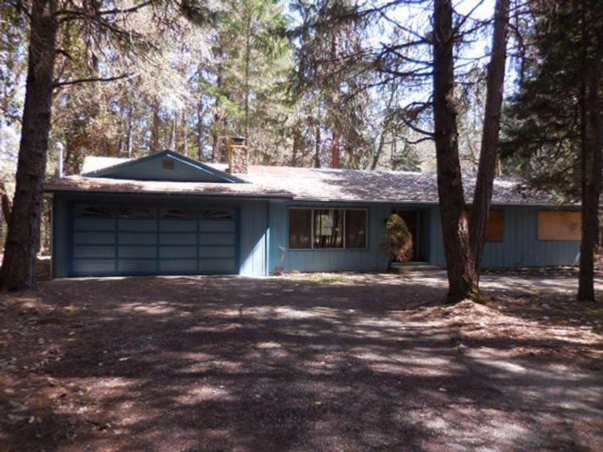 Surround yourself with 5 wooded acres in this home located in scenic rural Grants Pass. House features quaint kitchen, 1576 square feet of living space, 2 bedrooms and 2 bathrooms, and attached garage. House is a fixer, but with some TLC, would be a great property.