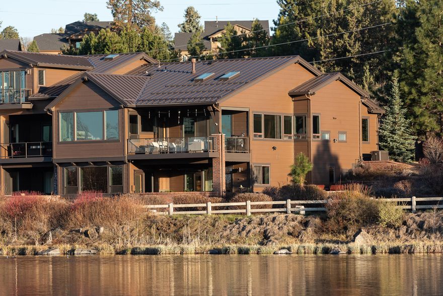 This 3206sf, 2-level RIVERFRONT Deschutes Landing Townhome features unobstructed views of the Cascade Mountains, Deschutes, parks, and the Old Mill District with stunning sunsets from almost every window. Living in this prime location makes for an easy jaunt to mountains, river trails, entertainment, shopping and dining as well as easy access to Hwy 97.  Built in 2021, with 3206 sf/3 bed/3 1/2 baths, this home has an attached 2-car/finished garage and thoughtful, modern upgrades too extensive to list. Views from every window, high ceilings and doors plus two (heated) decks right on the river provides the option of an exciting Central Oregon lifestyle, or a peaceful place to daydream and watch the river go by. All this right in the center of Bend!