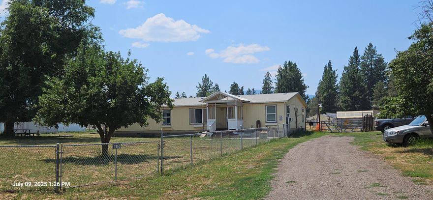 Great opportunity in the Keno area.  Large 3BR, 2BA manufactured home with a spacious garage/shop, and ample outdoor space, there's plenty of room for hobbies, gardening , raising chickens and small farm animals with shelters, sheds and outbuildings already in place. The perimeter fence adds security, while the greenhouse could be perfect for extending the growing season.   Over an acre of land for your enjoyment!