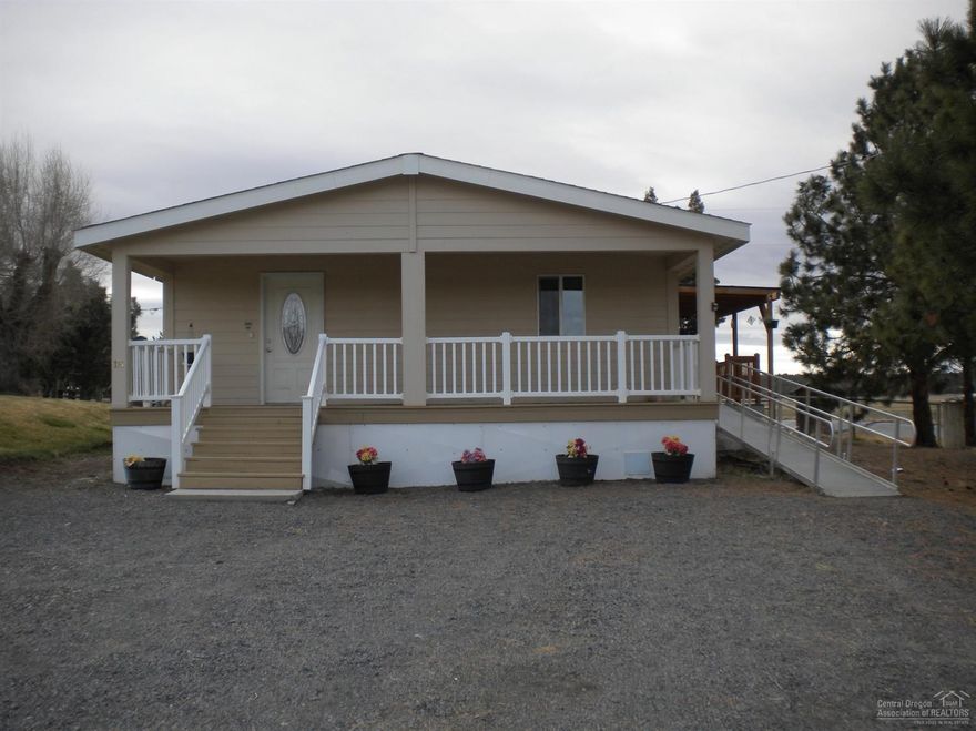 Come home to quiet and tranquility in the country. Located in Country Homes Mobile Home Park this 2012, 3 bedroom, 2 bath manufactured home has wood grain laminate floors, carpeted bedrooms, black appliances, solid wood cabinetry in kitchen and baths, dual master sinks, large laundry room and large front and side decks. Enjoy watching the deer, cattle and goats or catch the beautiful sunsets and mountain views. Wide hallway and handicap accessible features are just a bonus. Call today for an appointment