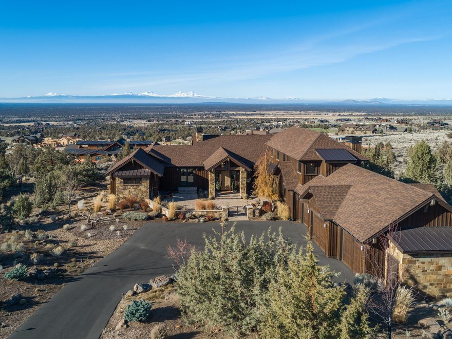 BRASADA RANCH CUSTOM HOME. Cascade Mtn Views from ALL BDRMS, Great Room, Kitchen & Upstairs Bonus.  Quality materials were selected! Wide plank hand scraped hard wood floors, solid surfaces, fully tiled showers, wood truss beams, paver deck, surround sound and Control4 smart home system with remote access. Primary Bdrm on the main level with gas fireplace, bath has separate vanities with under cabinet lighting & step up jetted tub. All bedrooms have walk in closets with built-in dressers, cabinets & shelves. Lg. second Bdrm on main level with ensuite. Unique downstairs with theatre room, large screen wall mounted TV, sound system, 10 movie theatre chairs, classic diner with booth seating, a wet bar with dishwasher, two additional flex rooms, 1 full bath and built in bunks. The laundry room also makes a great space for your craft projects with plenty of counter space and built in cabinets. Home is move in ready, includes all home furnishings with a few exceptions. Below grade Sq Ft 1290