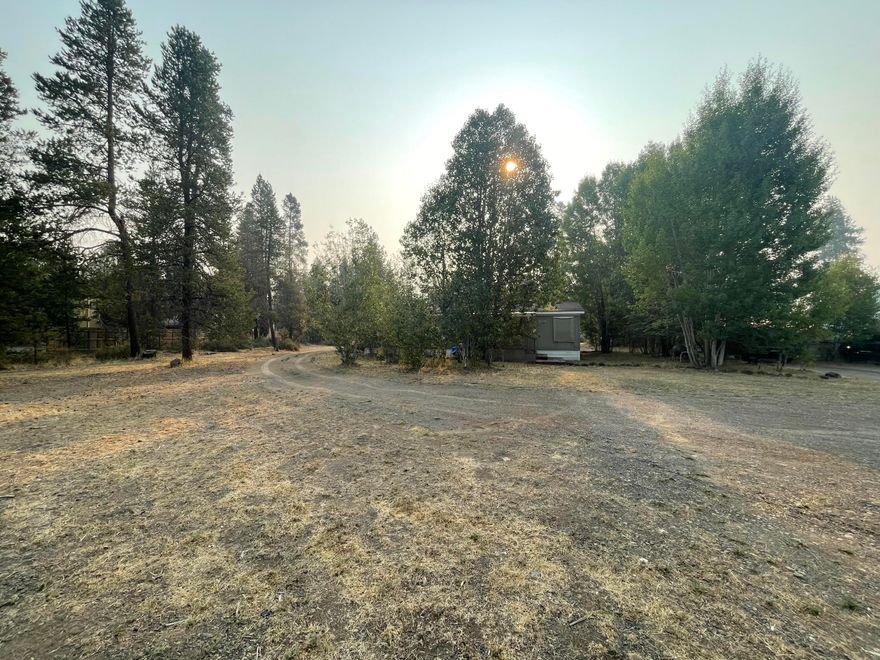 Commercial setting in a great location with prime exposure on Highway 97 just north of La Pine in Wickiup Junction.  There are two lots being sold together and they are zoned CMX.  CMX is a mixed use zone for residential and commercial.  The manufactured home is currently rented month-to-month for residential use for $975.00 per month.  The additional lot is 52714 Highway 97 and it is .29 acres. Map 211036AB and Tax Lot 02101.  Mark Halvorsen, one of the sellers, is an Oregon Real Estate Broker.