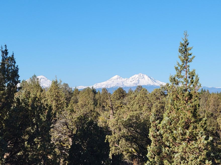 Looking for a spectacular build site with Cascade Mt. views for your custom home plans? Well, look no further. This 5.13 acres has views from Three Sisters to Smith Rocks and everything in between. Plenty of Room for your home, shop, barn, 4 legged friends and toys. Odin-Crest Estates development is a quiet area of natural beauty, truly one of those jewels of Central Oregon w/o the strict CC&R's or HOA's. Centrally located within the Bend, Sisters and Redmond triangle. Close to Public lands, Deschutes River and Eagle Crest. CEC Power, water to the build site.  Septic tank sited on property. Ready for you to pull building permits and get started fulfilling your dreams.