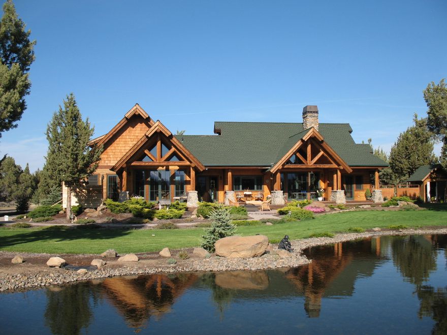 This custom mtn. rustic Tumalo home sits on over 8 acres and is just minutes to the heart of Bend. Step inside, take in the breath-taking panoramic views of the Cascades and sit, enjoy the comfort of the wood burning fireplace after recreating in Central Oregon's great outdoors. Custom floor to ceiling windows, vaulted ceilings, accented timbers, frame the breath-taking scenery and a beautifully landscaped yard and the wood doors perfectly transition you to the outside living space. On the main level, you have well-designed separation of bedrooms, and a office that is perfect for working from home. The kitchen has stainless steel appliances, porcelain counter tops, built in wine rack and breakfast bar. And the primary is nicely appointed with dual vanities, soaking tub, and a walk-in closet. Outside doors off the primary and guest quarter, lead you to the backyard oasis. The 606 sq. ft. bonus room has endless potential and the shop built in 2021 could easily be converted to an ADU