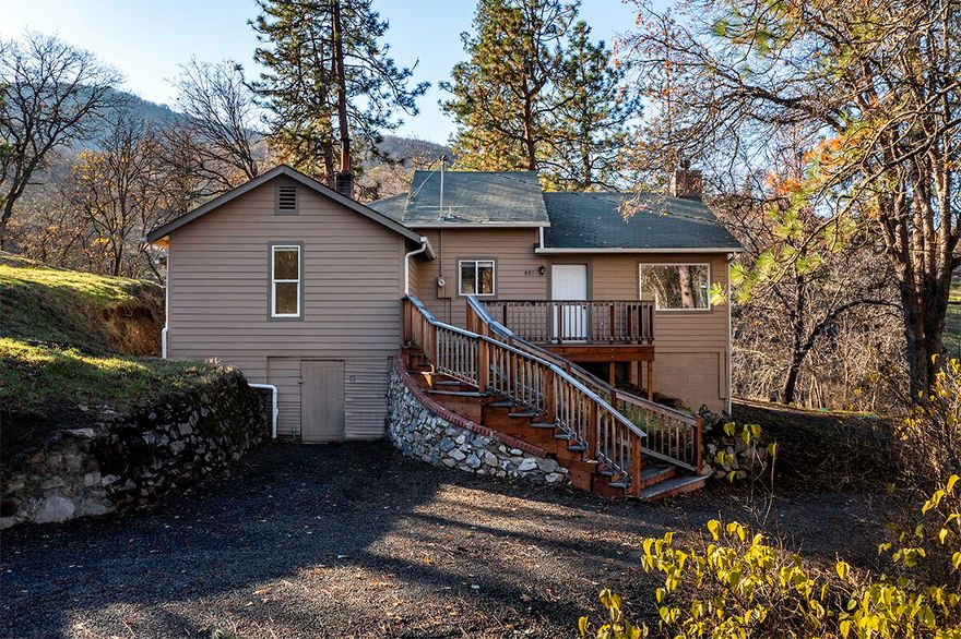 BANKS LAUGHED AT LOW RATES AND LOW PAYMENTS - WE SAID YES! CHEAPER THAN RENTING WITH OUR SUPER CREATIVE OWNER-CARRY TERMS! Call for details!  Sweet home on 10 acres right in town in beautiful Ashland. Newly refreshed with interior paint, new carpeting, driveway has been improved & new staging.  Rare offering with room to roam on 10.03 acres, zoned RR-5 in urban growth boundary! Located at the edge of the desirable Wrights Creek neighborhood, this gem is awaiting its new owner. Sweet 1372 sf home.  Buyer to do own diligence with City to determine potential for adding additional structures. Vaulted ceiling, nice fireplace with stone tile-surround & windows overlooking the natural setting, trees & open meadow. Kitchen is updated with granite counters & in-kitchen dining. 3 bedrooms & 1 bath on main level plus laundry room. Upper attic loft area is vaulted, finished & makes a great bonus space, office or bedroom. Private setting.