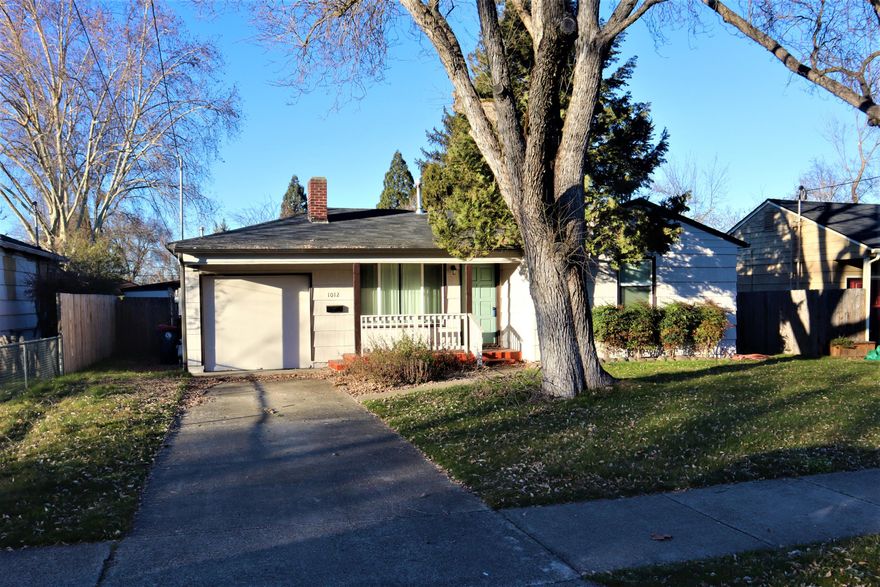 Adorable Cottage Home on a quiet street. Recent improvements include New Roof in 2013, New Vinyl Double-Paned Windows in 2016, New Furnace in 2017, Chimney Serviced 2018, New Deck 2018, New Sewer line in 2018, New Water Heater 2019, New Fencing 2020, New Gutters 2020, New Exterior and Interior Paint 2021, New Kitchen countertops 2021, and Additional Attic Insulation 2016. Original refinished Hardwood Flooring throughout. This would be a fabulous home for 1st-time Homebuyers or Investors. Big Back Yard with Privacy Fencing and lovely Storage Shed. Don't miss out on this one – It's a true Gem.